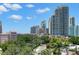 Great aerial view showing downtown skyline featuring high-rise buildings and lush green trees at 700 Beach Ne Dr # 803, St Petersburg, FL 33701