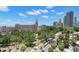 Beautiful aerial view featuring a street, the Don CeSar hotel, and blue skies with scattered clouds at 700 Beach Ne Dr # 803, St Petersburg, FL 33701