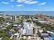 An aerial view looking straight down the street at the white condo building and towards the ocean at 700 Beach Ne Dr # 803, St Petersburg, FL 33701