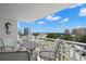 Relaxing balcony featuring patio furniture and stunning views of the city skyline at 700 Beach Ne Dr # 803, St Petersburg, FL 33701