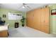 Versatile bedroom with a Murphy bed system, creating a multi-functional space for work and relaxation at 700 Beach Ne Dr # 803, St Petersburg, FL 33701
