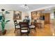 Open dining area with hardwood floors, elegant decor, and adjacent to the kitchen, ideal for entertaining at 700 Beach Ne Dr # 803, St Petersburg, FL 33701