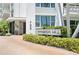 The entrance to the Harbour Hill condo complex features meticulous landscaping with brick pavers and elegant signage at 700 Beach Ne Dr # 803, St Petersburg, FL 33701
