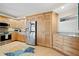 Well-equipped kitchen with stainless steel appliances, custom cabinetry, and a window for natural light at 700 Beach Ne Dr # 803, St Petersburg, FL 33701