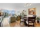 Bright living room with hardwood floors, sliding glass doors to a balcony, and comfortable seating area at 700 Beach Ne Dr # 803, St Petersburg, FL 33701