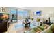 Cozy living room with balcony access, contemporary furnishings, and vibrant rug that enhances the space at 700 Beach Ne Dr # 803, St Petersburg, FL 33701
