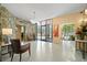 Inviting building lobby with natural stone accents, comfortable seating, and great lighting at 700 Beach Ne Dr # 803, St Petersburg, FL 33701