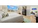 Spacious main bedroom boasts large windows with a stunning view, hardwood floors, and access to the living room at 700 Beach Ne Dr # 803, St Petersburg, FL 33701