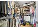 Organized walk-in closet offers ample storage with shelves, rods, and compartments to neatly arrange your wardrobe at 700 Beach Ne Dr # 803, St Petersburg, FL 33701