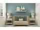 Calm Bedroom featuring a wooden crib, soft bedding, and stylish decor at 7525 E 116Th St, Palmetto, FL 34221