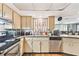 Well-appointed kitchen with stainless steel appliances and classic cabinetry, perfect for Gathering meals at 8907 Pandora Ln, Port Richey, FL 34668