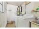 Functional laundry room equipped with washer, dryer, and water heater at 8907 Pandora Ln, Port Richey, FL 34668