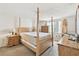 Bright main bedroom featuring a four-post bed frame and ample space for furniture and relaxation at 8907 Pandora Ln, Port Richey, FL 34668