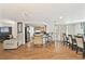 A open floor plan with hardwood floors, kitchen with bar, and dining room at 8907 Pandora Ln, Port Richey, FL 34668