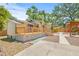 Beautiful backyard with a deck, pergola-covered seating area, and lush landscaping at 906 E Broad St, Tampa, FL 33604