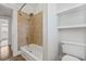 Bathroom features a tub with tile surround and built-in shelving at 906 E Broad St, Tampa, FL 33604