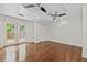 Bedroom with hardwood floors, closet, recessed lights and French doors to a deck at 906 E Broad St, Tampa, FL 33604