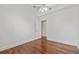 Bright bedroom with hardwood floors and a ceiling fan, providing a comfortable and airy space at 906 E Broad St, Tampa, FL 33604