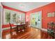 Bright dining room with gleaming hardwood floors and ample natural light at 906 E Broad St, Tampa, FL 33604