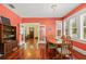 Bright dining room with hardwood floors, large windows, and stylish decor at 906 E Broad St, Tampa, FL 33604