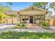 Charming home with brick walkway, welcoming porch, and carport at 906 E Broad St, Tampa, FL 33604
