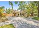 Charming home with a spacious driveway and a welcoming covered porch at 906 E Broad St, Tampa, FL 33604