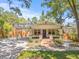 Charming home with brick walkway, inviting porch, and convenient carport at 906 E Broad St, Tampa, FL 33604