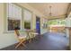Inviting front porch with seating area, ideal for relaxing outdoors at 906 E Broad St, Tampa, FL 33604