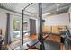 Home gym featuring workout equipment, weights, and ample space for fitness activities at 906 E Broad St, Tampa, FL 33604