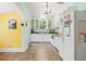 Charming kitchen features white cabinets, updated appliances, and a window above the sink at 906 E Broad St, Tampa, FL 33604