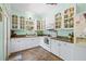 Bright kitchen with white cabinets, modern appliances, and ample storage space at 906 E Broad St, Tampa, FL 33604