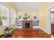 Bright living room with a brick fireplace and built-in shelving at 906 E Broad St, Tampa, FL 33604