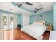 Spacious bedroom with french doors, tray ceiling, and hardwood floors at 906 E Broad St, Tampa, FL 33604