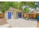 Backyard outbuilding with blue doors at 906 E Broad St, Tampa, FL 33604