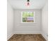 Neutral room shows tile floors, white walls and a large window to let in natural light at 906 E Broad St, Tampa, FL 33604