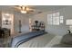 Comfortable bedroom featuring a ceiling fan, decorative artwork, and stylish furniture at 9410 Alanbrooke St, Temple Terrace, FL 33637