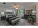 Well-lit bedroom with a large window, ceiling fan, and stylish furnishings at 9410 Alanbrooke St, Temple Terrace, FL 33637