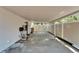 An empty carport provides shaded parking at 9410 Alanbrooke St, Temple Terrace, FL 33637
