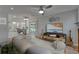 Open-concept living room with access to the kitchen and a view of the pool at 9410 Alanbrooke St, Temple Terrace, FL 33637