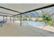 Enclosed pool with a spa, landscaping and screened enclosure, creating a private outdoor oasis for relaxation at 9410 Alanbrooke St, Temple Terrace, FL 33637