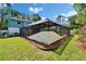 Enclosed lanai featuring lush plants, providing a relaxing outdoor living space at 9410 Alanbrooke St, Temple Terrace, FL 33637