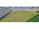 Large backyard featuring a privacy fence, and fresh green grass for outdoor activities at 9914 Calypso Orchid Ct, Riverview, FL 33578