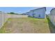 Spacious backyard featuring a privacy fence and plenty of room for outdoor activities at 9914 Calypso Orchid Ct, Riverview, FL 33578