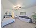 Cozy bedroom featuring neutral tones, a ceiling fan, and ample space, creating a comfortable and inviting atmosphere at 9914 Calypso Orchid Ct, Riverview, FL 33578