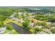 A high angle view shows the property's serene lakeside location and mature landscaping at 2207 Climbing Ivy Dr, Tampa, FL 33618