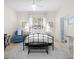Comfortable bedroom with neutral tones, an area rug, and a window with natural light at 2207 Climbing Ivy Dr, Tampa, FL 33618