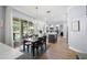 Open-concept dining area flows to a living space and features a view of the pool area through sliding glass doors at 2207 Climbing Ivy Dr, Tampa, FL 33618