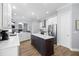 Bright and airy kitchen with white cabinets, island with seating, stainless appliances, and open layout at 2207 Climbing Ivy Dr, Tampa, FL 33618