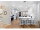 Spacious kitchen featuring an island with seating, stainless steel appliances, and hardwood floors at 2207 Climbing Ivy Dr, Tampa, FL 33618