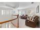 Cozy living room showcasing neutral tones, comfortable seating, and plantation shutters for natural light control at 2207 Climbing Ivy Dr, Tampa, FL 33618